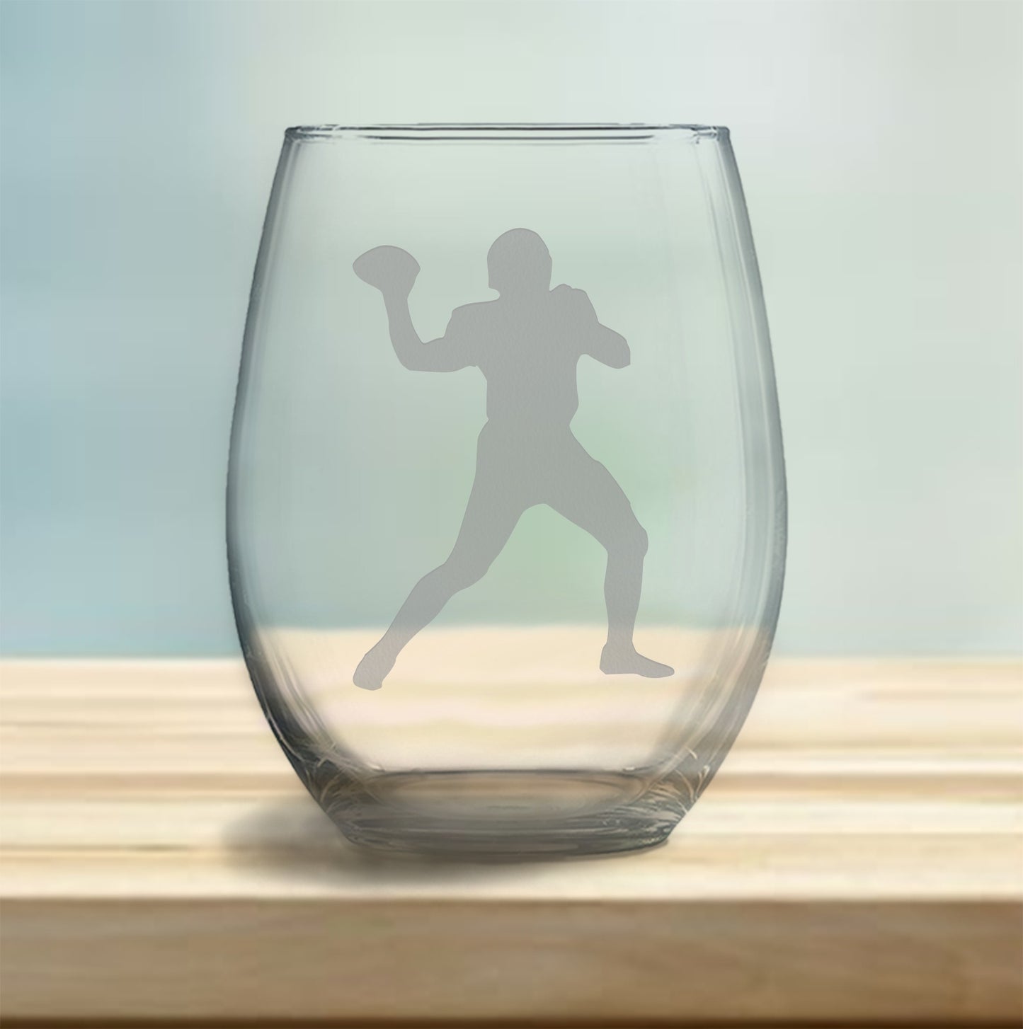 Etched football player design stemless wine glass – perfect gift for football fans, ideal for enjoying wine with a sporty, athletic touch.