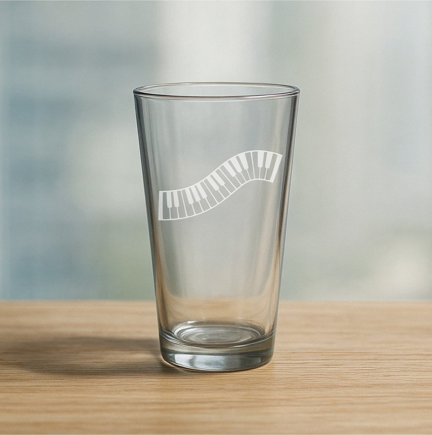 Custom etched pint glass featuring piano keys design – personalized beer glass gift for musicians, piano players, and music lovers