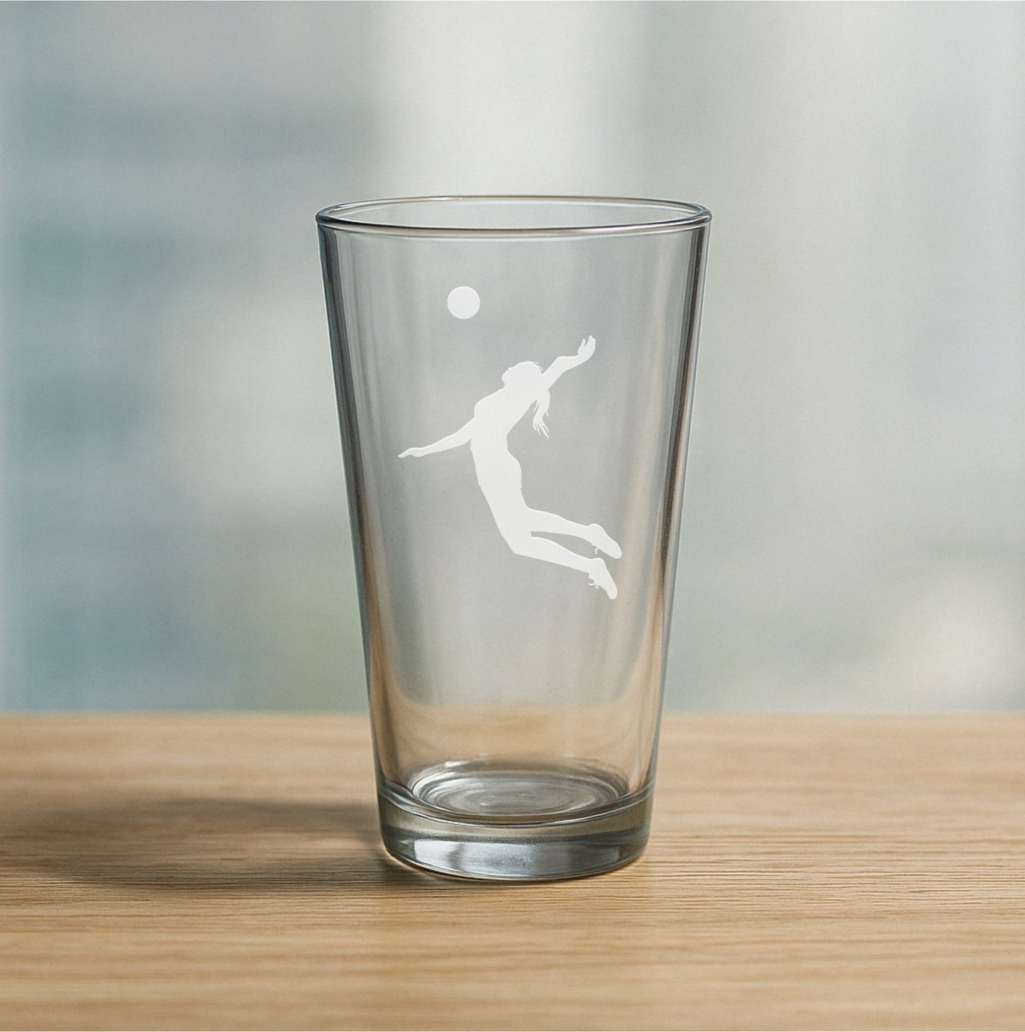 Custom etched pint glass featuring female volleyball player design – personalized beer glass gift for athletes, volleyball teams, and sports celebrations