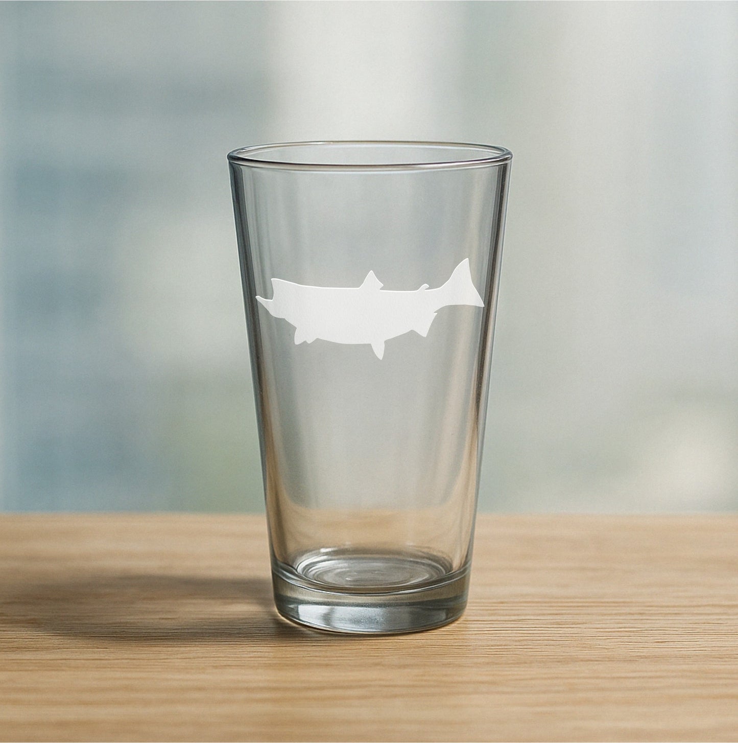 Custom etched pint glass featuring salmon design – personalized beer glass gift for fishing enthusiasts and nature lovers