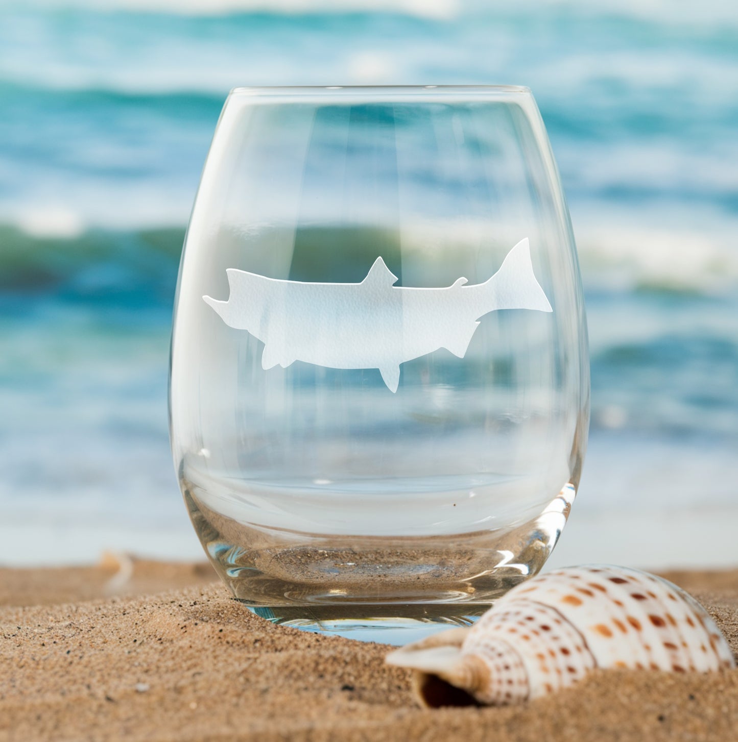 Stemless wine glass with etched salmon silhouette design – perfect gift for fishing enthusiasts, ideal for wine lovers who appreciate nature-inspired decor.