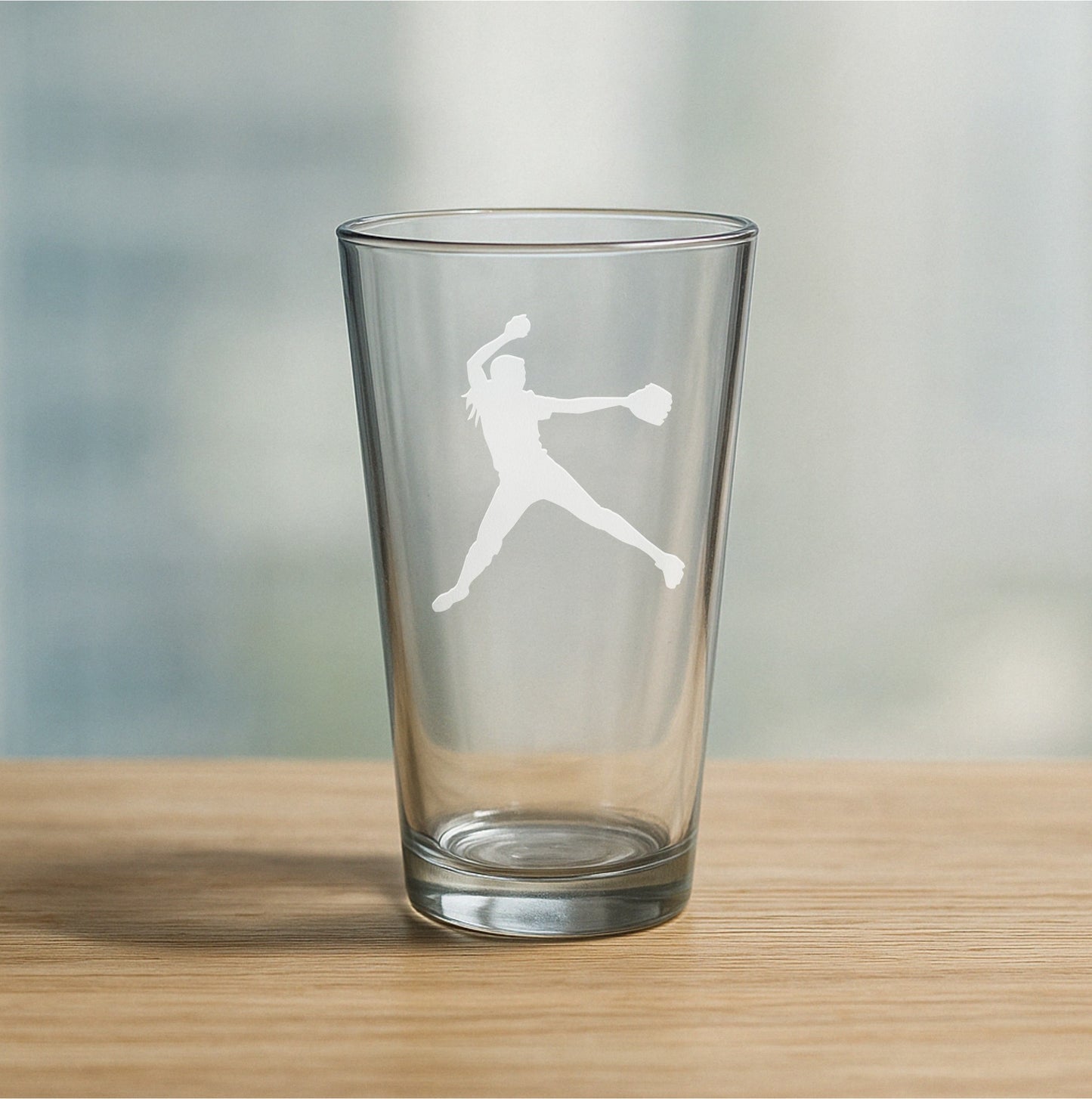 Custom etched pint glass featuring female softball pitcher design – personalized beer glass gift for softball players, coaches, and sports teams