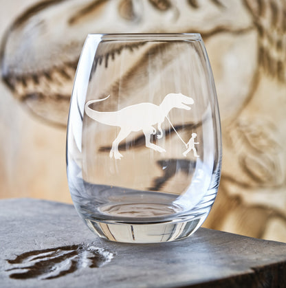Stemless wine glass with etched boy walking T-Rex design – a fun and adventurous design featuring a boy walking alongside the mighty T-Rex, perfect for dinosaur enthusiasts.