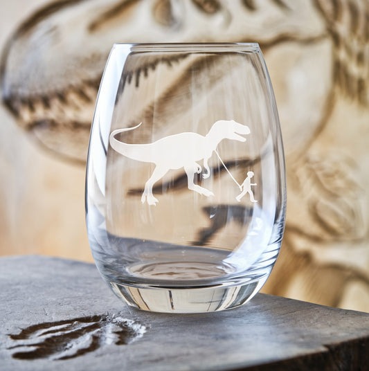 Stemless wine glass with etched boy walking T-Rex design – a fun and adventurous design featuring a boy walking alongside the mighty T-Rex, perfect for dinosaur enthusiasts.