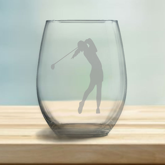 Stemless wine glass with etched female golfer design – perfect gift for golf enthusiasts, ideal for enjoying wine with a sporty, elegant touch.