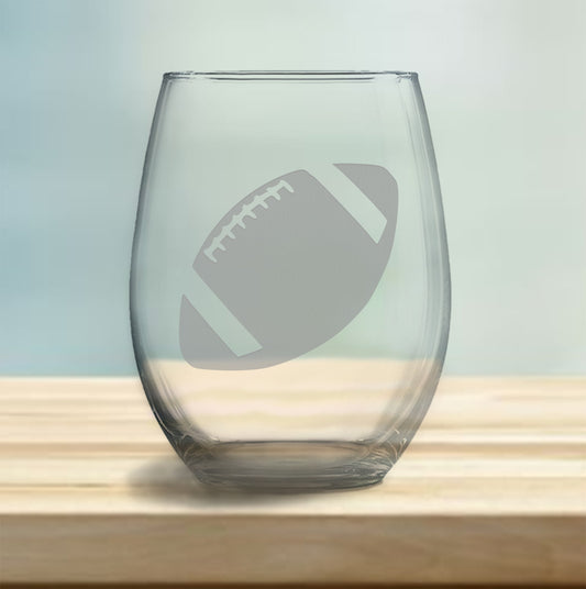 Stemless wine glass with etched football design – perfect gift for football fans, ideal for enjoying wine with a sporty, athletic touch.