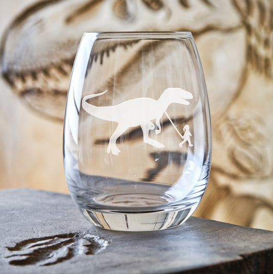 Stemless wine glass with etched girl walking T-Rex design – a creative and playful design, blending the charm of a walking T-Rex with the grace of a young girl, making it an unforgettable gift.